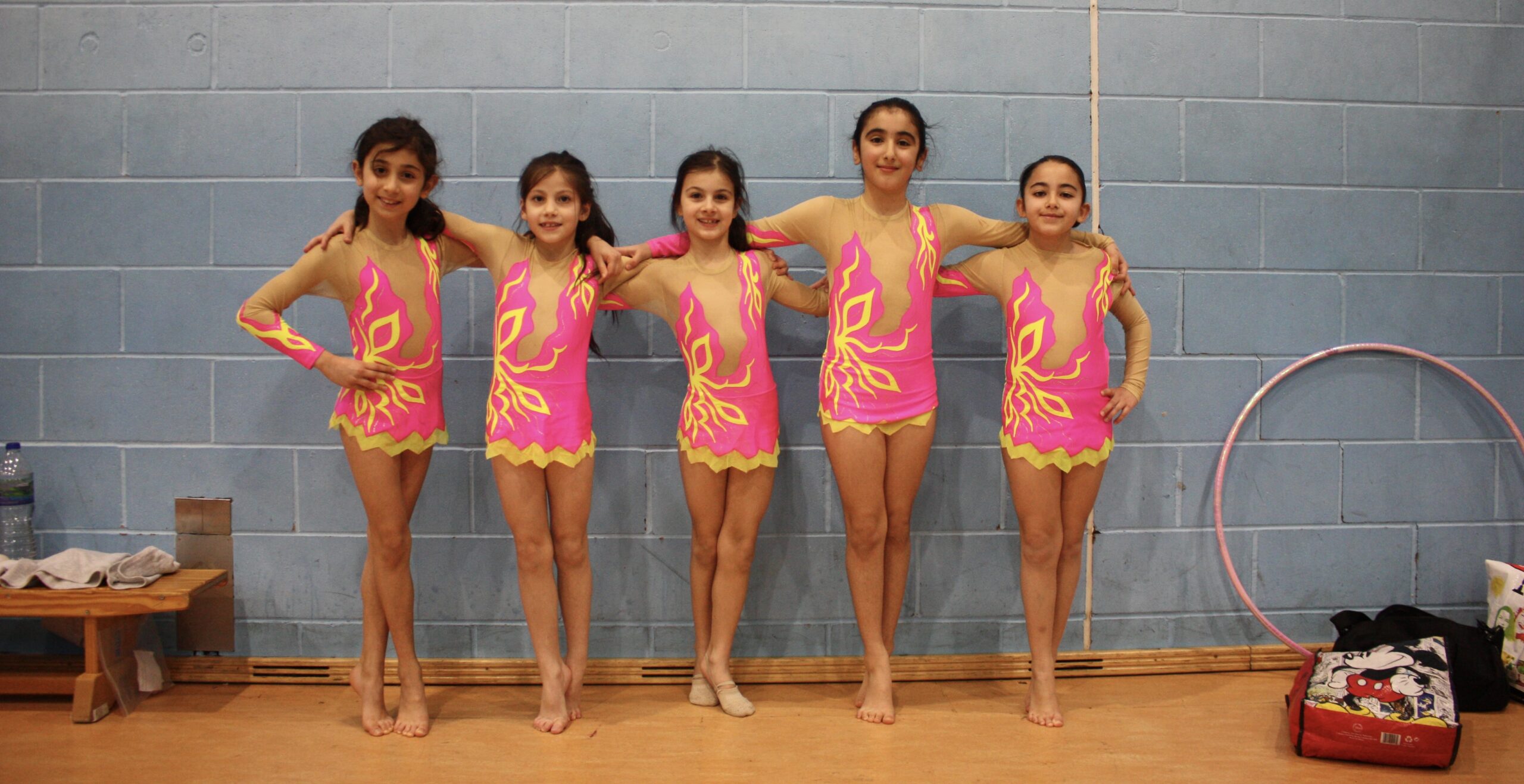 Rhythmic gymnastics classes build flexibility, coordination, and dance skills. Suitable for ages 4+ at all levels.